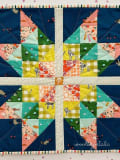 Woollypetals Starfy Mini Quilt with colorful sawtooth star design