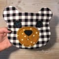 Woollypetals Bear Pouch with checkered fabric and embroidered face