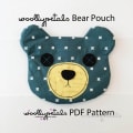 Woollypetals Bear Pouch in teal with white cross pattern and yellow muzzle