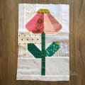 Woollypetals Echinacea Quilt Block with pink petals and green leaves