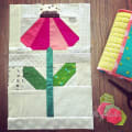 Woollypetals Echinacea Quilt Block with pink petals and green leaves