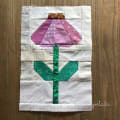 Woollypetals Echinacea Quilt Block with purple petals and green leaves