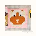 Woollypetals It's All Guinea Be Okay quilt block with orange guinea pig face on pink background