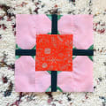 Woollypetals Hearts All Around Quilt block with pink hearts and red X Star center