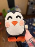 Woollypetals Penguin Pillow with black and white felt, orange beak and cheeks