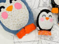 Woollypetals Penguin Pillow pattern in multiple sizes with fabric pieces