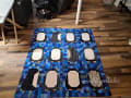 Woollypetals Penguin Social Quilt in blue patchwork with white and black penguin blocks