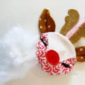 Woollypetals Reindeer Ornament with red and white fabric body, brown ears, and gold glitter antlers