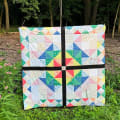 Woollypetals Starfy quilt in colorful star block pattern displayed outdoors