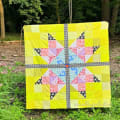 Woollypetals Starfy quilt in bright yellow with star blocks