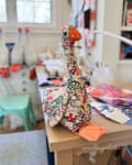 Woollypetals Silly Goose stuffed fabric bird with floral patterned body and orange head