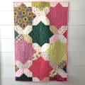 Woollypetals Floored quilt with colorful patchwork diamonds and stars
