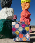Woollypetals Floored quilt with colorful star blocks displayed outdoors