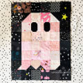 Woollypetals Ghost Party quilt featuring pink and black fabric blocks with spooky patterns