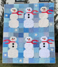 Woollypetals Do You Want to Sew a Snowman Quilt held up outdoors in winter