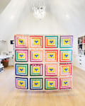 Woollypetals Clogged Quilt with colorful concentric heart blocks