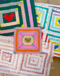 Woollypetals Clogged quilt with concentric squares and red hearts