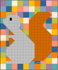 Woollypetals Squirrel quilt in colorful geometric blocks and orange fabric