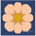 Woollypetals StarPetals Mini Quilt with peach and gold fabrics on blue checkered background