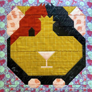 Woollypetals It's All Guinea Be Okay quilt block with yellow, red, black, and cream fabrics