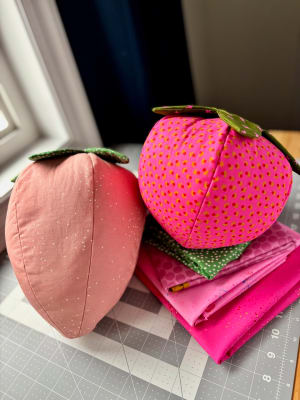 Woollypetals Strawberry Pillow in pink and coral fabrics with green stems