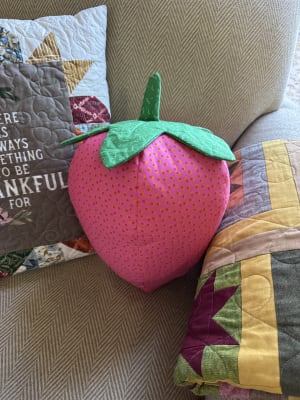 Woollypetals Strawberry Pillow stuffed project in bright pink with green leaves