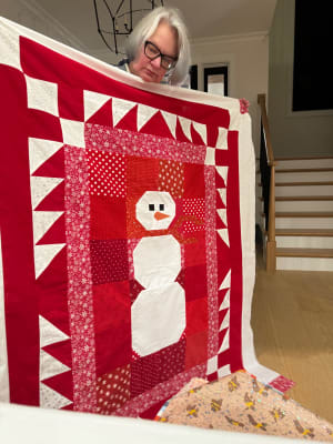 Woollypetals Do You Want to Sew a Snowman Quilt displayed in red and white fabrics