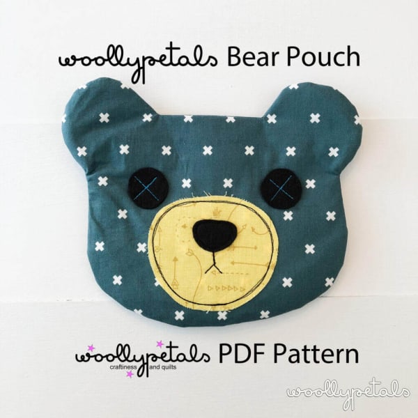 Woollypetals Bear Pouch in teal with white cross pattern and yellow muzzle