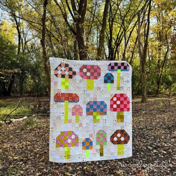 Woollypetals Capped quilt with yellow patchwork and appliqué animal blocks