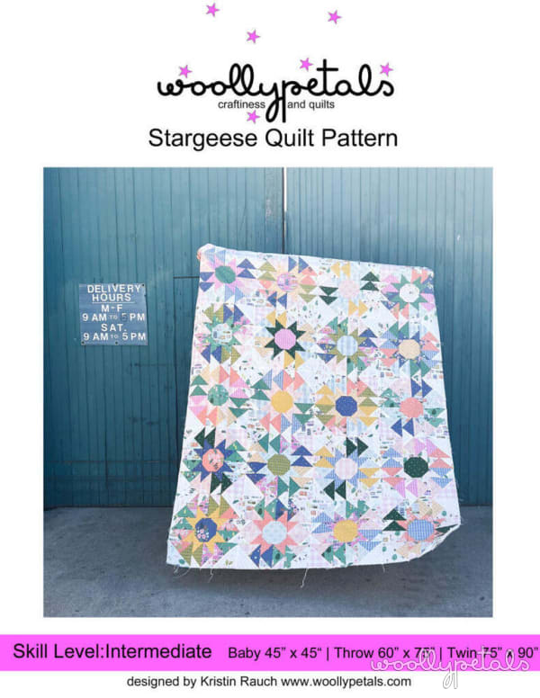 Woollypetals Stargeese Quilt displayed outdoors on a rural path
