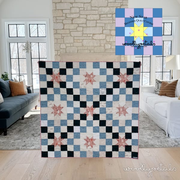 Woollypetals New Star quilt displayed in living room with blue, black, and pink fabrics