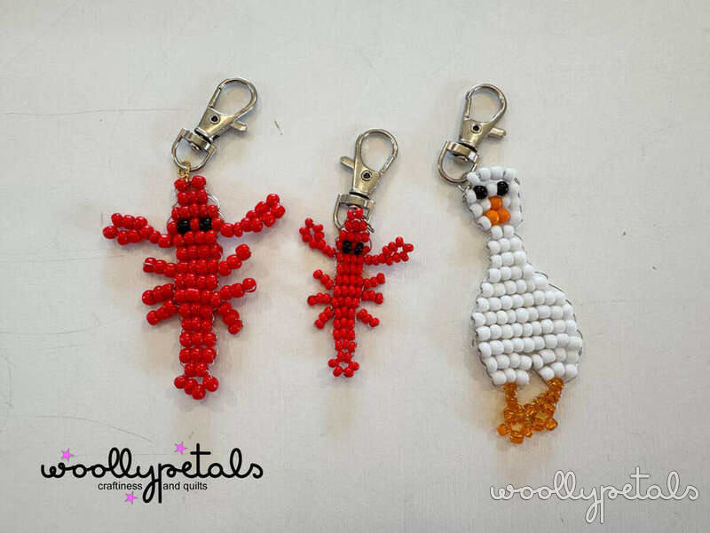 Woollypetals Beaded Sardine Charm keychains in red and white beads