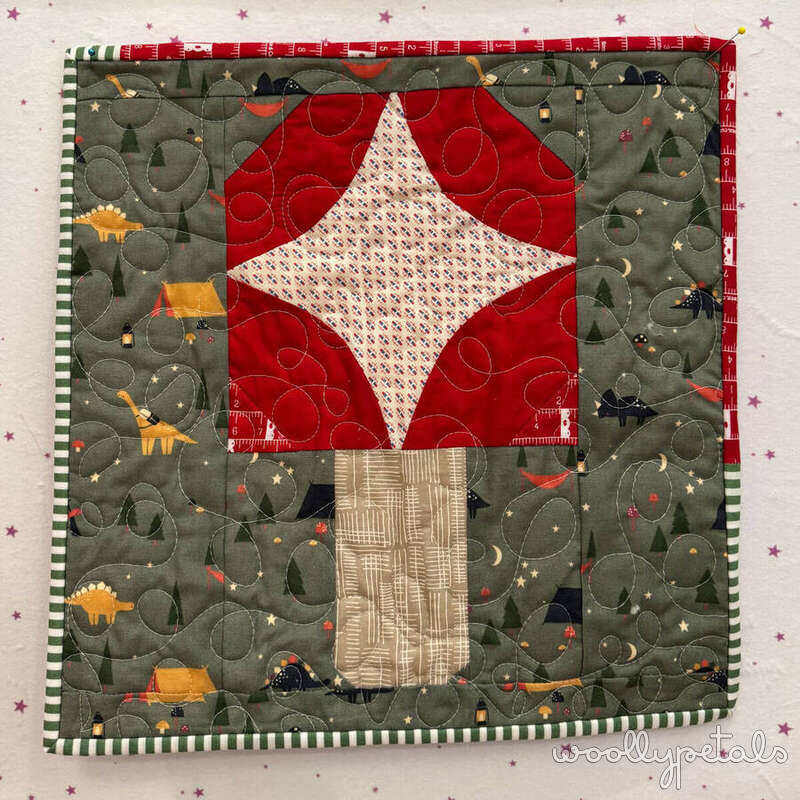 Camp Mushroom Free Block quilt in red, cream, and olive green fabrics