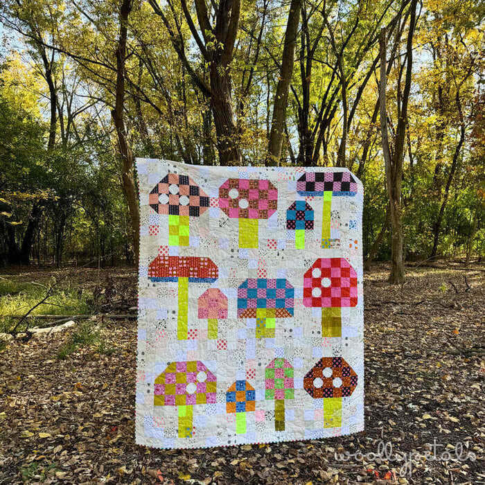 Woollypetals Capped quilt with colorful patchwork mushroom blocks