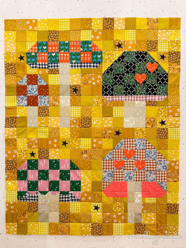 Woollypetals Capped quilt featuring patchwork mushroom blocks on yellow background