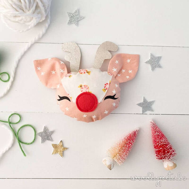Chicken Pincushion craft with peach fabric, antlers, and red nose decoration