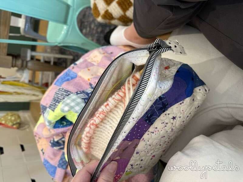 The Retreat Bag project bag with colorful patchwork fabric and striped zipper