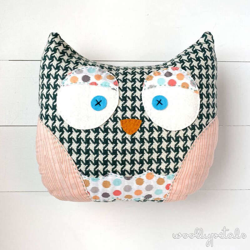 Handmade fabric owl pincushion with geometric patterned head and pink body