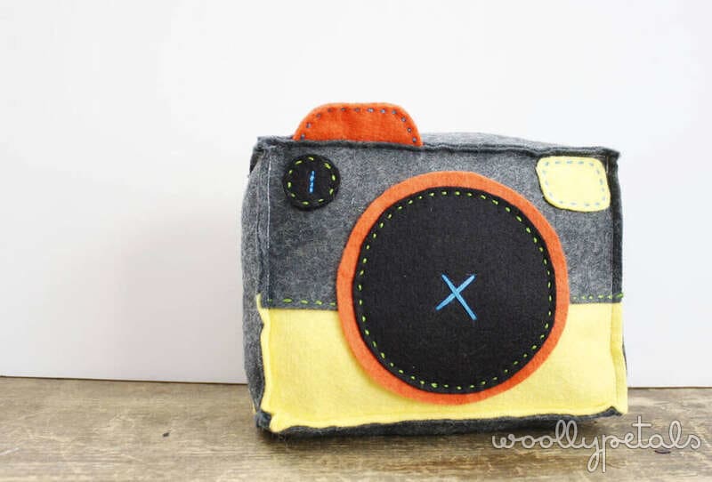 Handmade felt camera with gray, yellow, and orange details