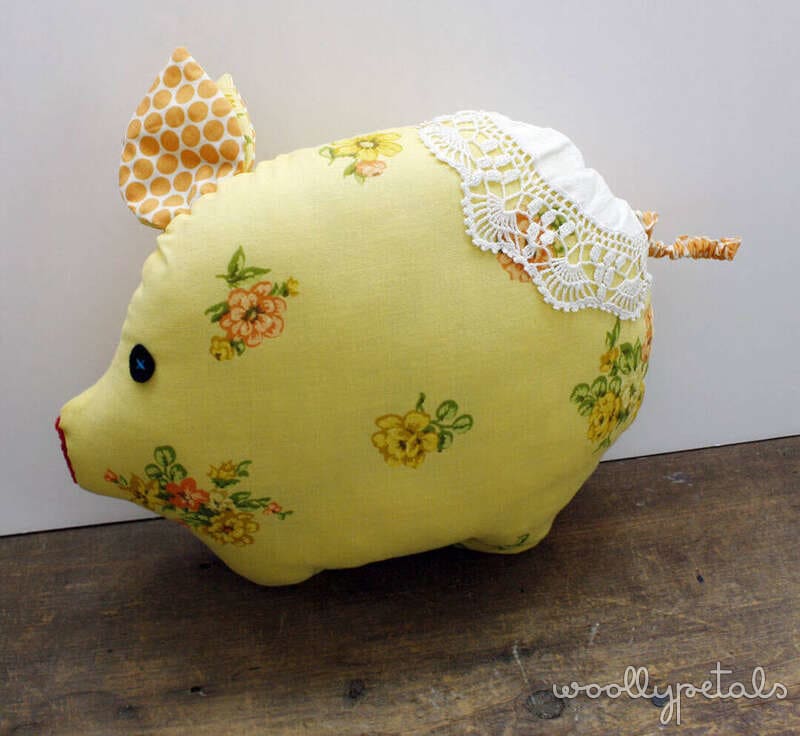 Silly Goose pincushion in yellow fabric with floral print and lace trim