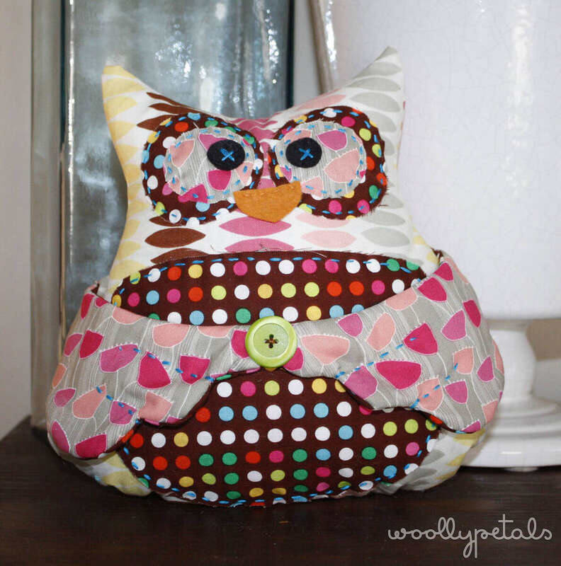Colorful fabric owl pincushion with polka dot belly and button detail