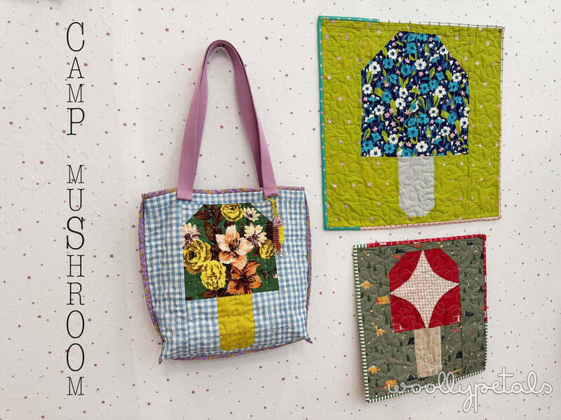 Camp Mushroom quilt patterns and tote bag displayed on wall