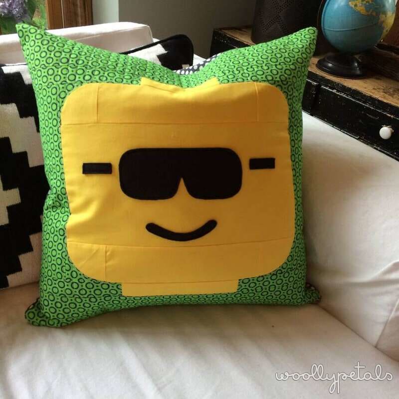 Cool guy pillow with yellow face and green patterned back