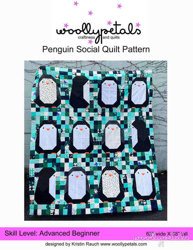 Woollypetals Penguin Social quilt with penguin appliqués on patchwork background