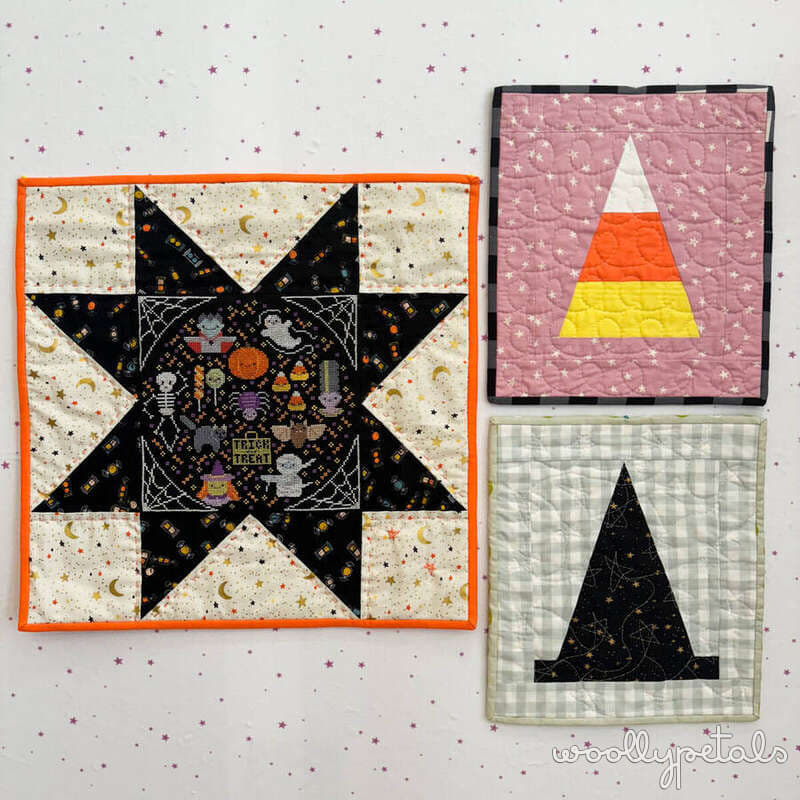 Three Halloween mini quilts with sawtooth star, candy corn, and witch hat designs