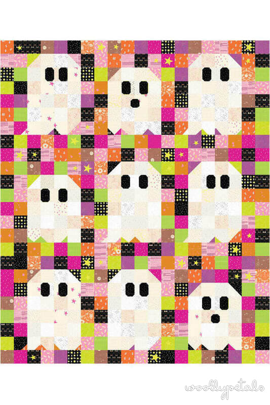 Woollypetals Ghost Party quilt with white ghost appliqués on colorful patchwork background