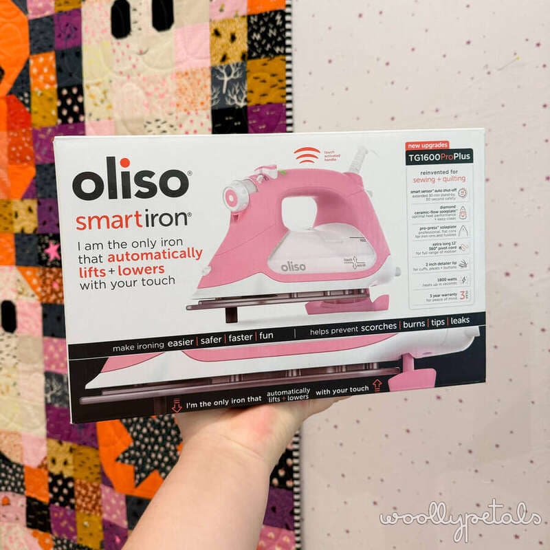 Oliso smart iron pink automatic lift and lower iron in packaging