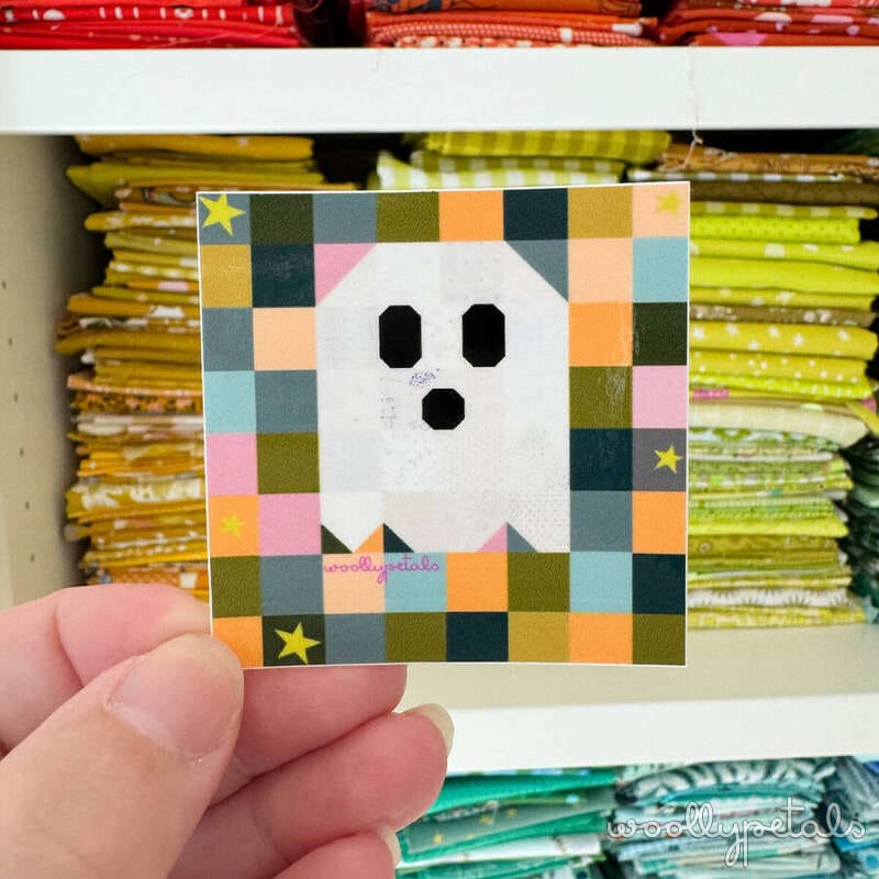 Woollypetals Ghost Party quilt block with white ghost on colorful checkered background
