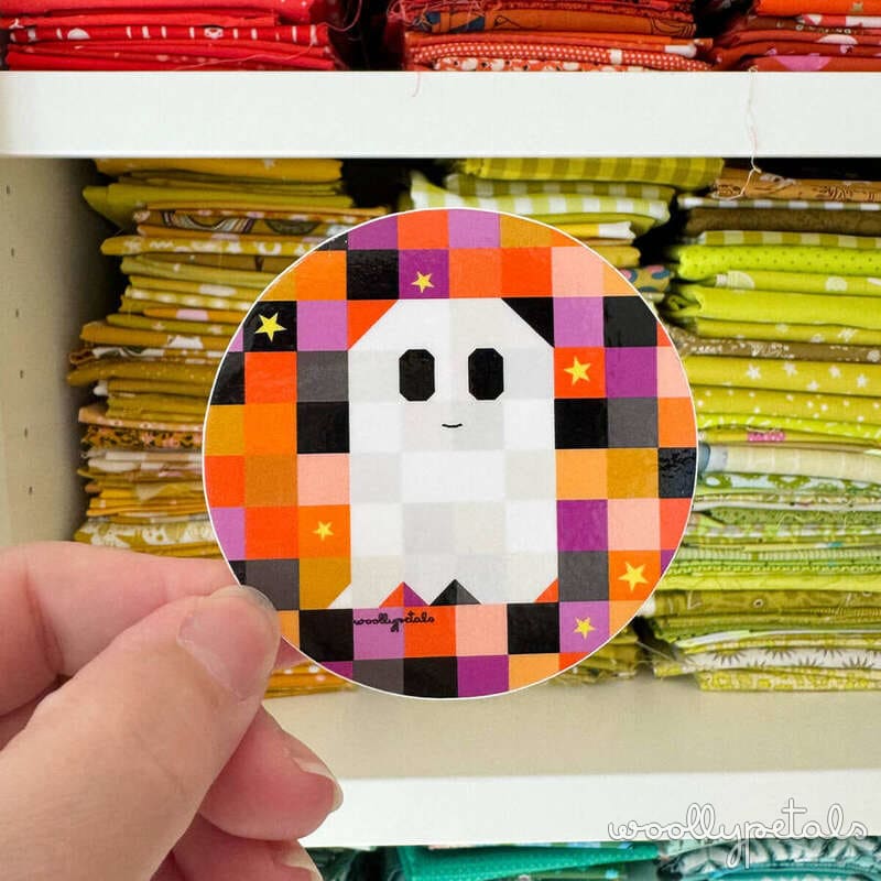 Woollypetals Ghost Party quilt block with colorful patchwork and white ghost appliqué
