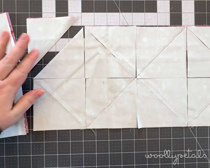 Woollypetals HST tutorial showing half-square triangle grid method with diagonal lines drawn on fabric squares